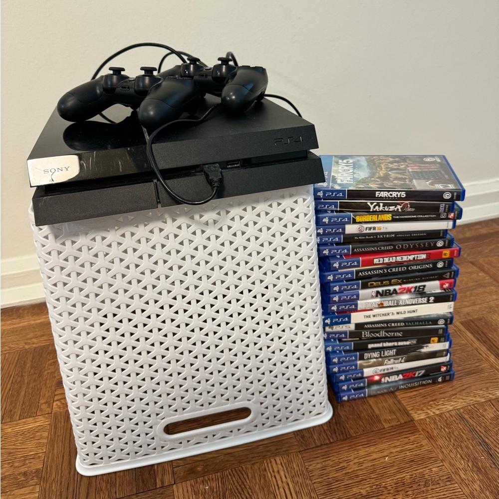 PlayStation 4 with 2 controllers and various games